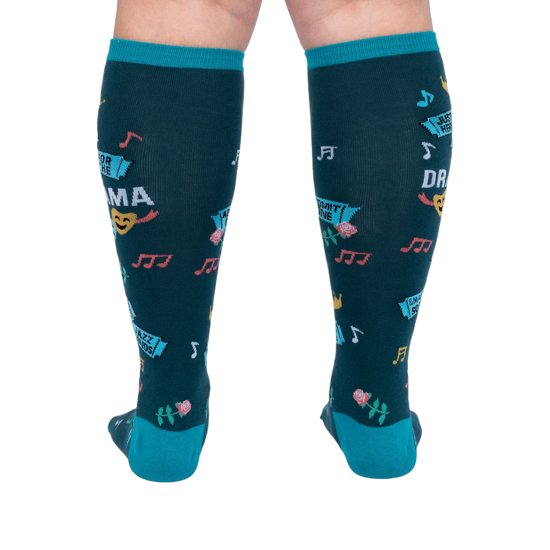 Back view of calves wearing dark teal knee-high socks, showing colorful music notes, pink roses, and blue ticket graphics.