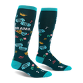 Dark teal knee-high socks with bright turquoise accents, featuring theater masks, roses, tickets, and drama text.