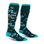 Dark teal knee-high socks with bright turquoise accents, featuring theater masks, roses, tickets, and drama text.