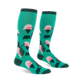 Pair of knee-high teal socks with a repeating philodendron leaf pattern in pink, white, dark green, and black. Dark green cuffs, heels, and toes.