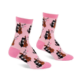 Pair of light pink crew socks with a repeating pattern of black cats playing string instruments, pink hearts, and music notes.
