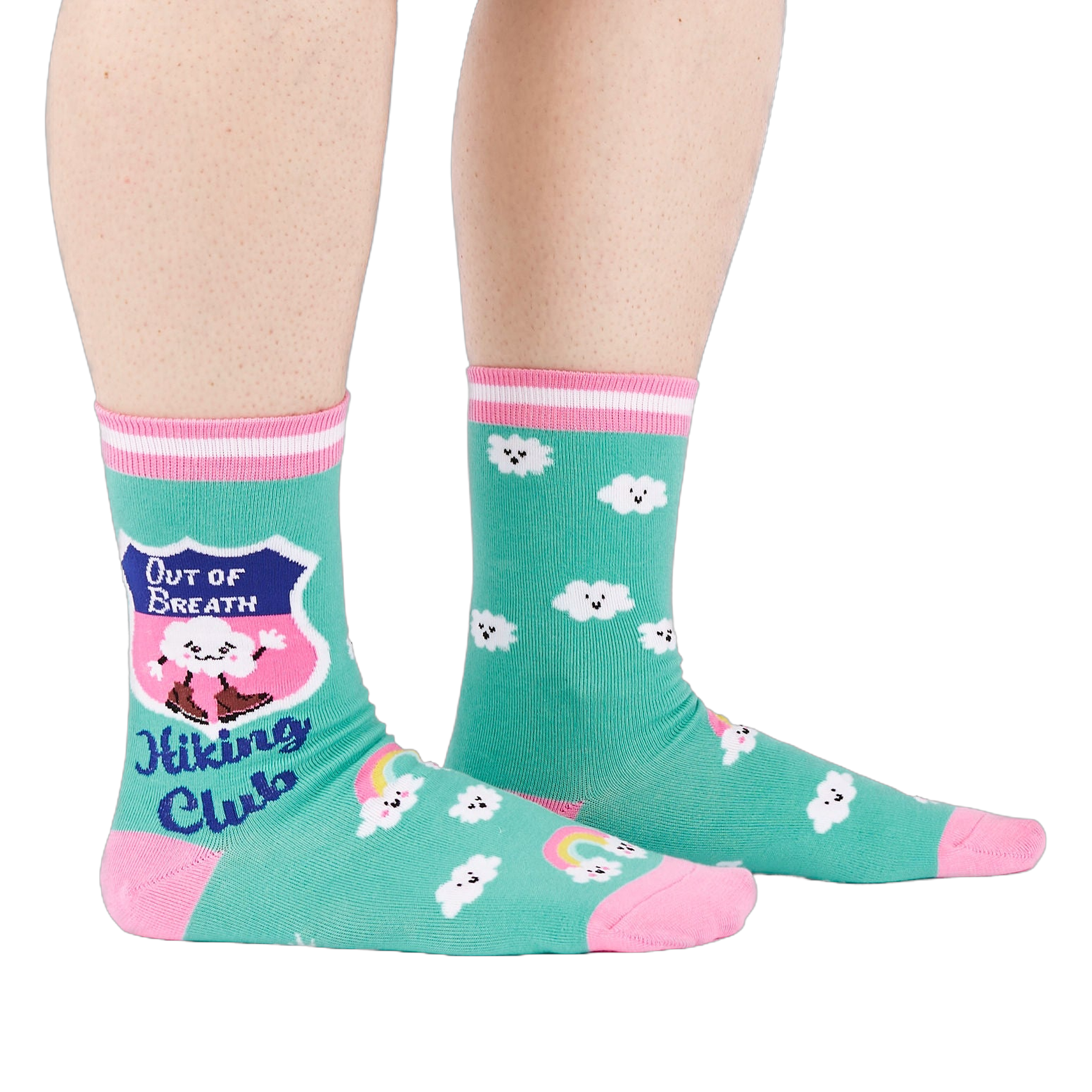 A person's legs wearing teal 'Hiking Club' crew socks, posed on a white background. Left sock shows shield design.