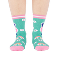 Front view of a person's legs wearing teal 'Hiking Club' crew socks. Both socks display the cloud pattern and 'Out of Breath' text.