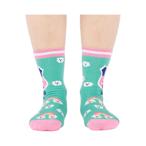 Front view of a person's legs wearing teal 'Hiking Club' crew socks. Both socks display the cloud pattern and 'Out of Breath' text.