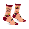 Pair of peach crew socks with dark red cuffs, heels, and toes, featuring a "Char-cute-erie" pattern of smiling cheese, olives, and red foods on boards, with small red hearts.