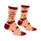 Pair of peach crew socks with dark red cuffs, heels, and toes, featuring a "Char-cute-erie" pattern of smiling cheese, olives, and red foods on boards, with small red hearts.
