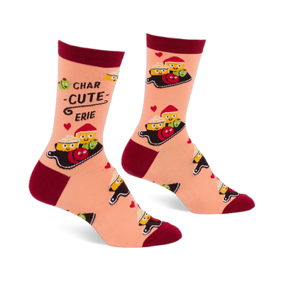 Pair of peach crew socks with dark red cuffs, heels, and toes, featuring a "Char-cute-erie" pattern of smiling cheese, olives, and red foods on boards, with small red hearts.