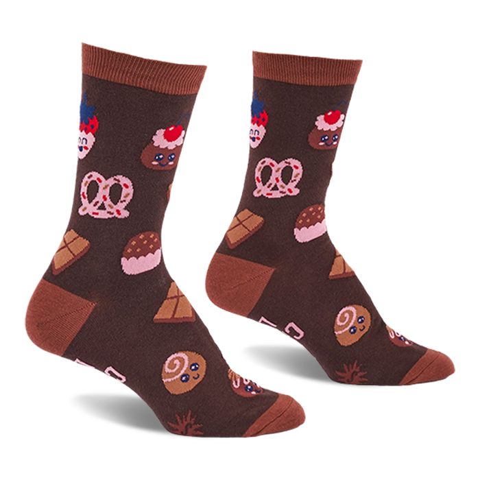 Pair of brown crew socks with light brown cuffs, heels, and toes, covered in a pattern of cupcakes, pretzels, and chocolate.