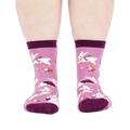 Person wearing the lavender 'Snuggle Bunny' crew socks, viewed from the front, showing leg and foot.
