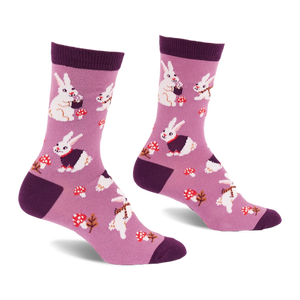 Pair of crew socks in soft lavender with white bunnies, some in dark purple vests, red mushrooms, and dark purple accents.