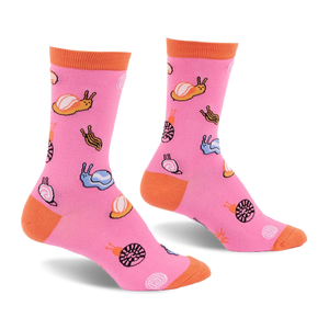 Bright pink crew socks featuring a pattern of colorful jelly candy snails and candy swirls with an orange cuff, heel, and toe.