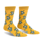 Yellow crew socks featuring a repeating pattern of green alligators doing tricks on bright blue skateboards.