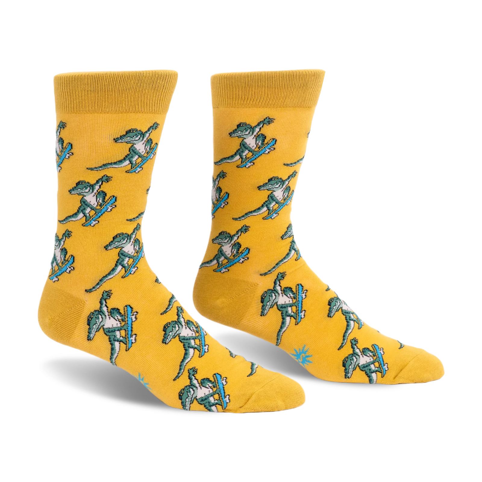 Yellow crew socks featuring a repeating pattern of green alligators doing tricks on bright blue skateboards.
