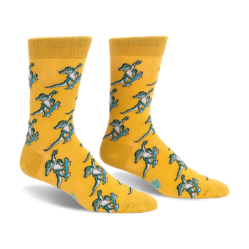 Yellow crew socks featuring a repeating pattern of green alligators doing tricks on bright blue skateboards.