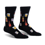Black crew socks featuring a pattern of frothy beer mugs, brown bottles, yellow bottles, and silver IPA beer cans.
