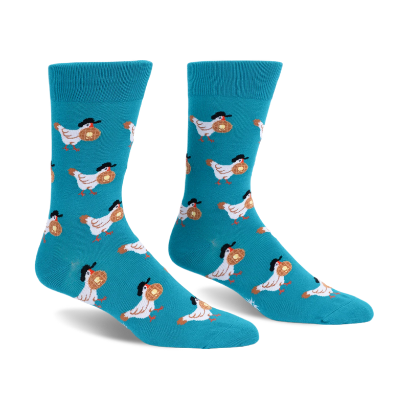 Bright teal crew socks displaying a pattern of white chickens wearing black hats and carrying round waffles with butter.