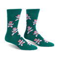 Pair of green crew socks featuring a pattern of pink pigs wearing white karate uniforms and red belts in martial arts poses.