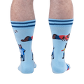 Back view of the socks worn on legs, highlighting a bear in a blue and white striped jersey standing with a soccer ball.