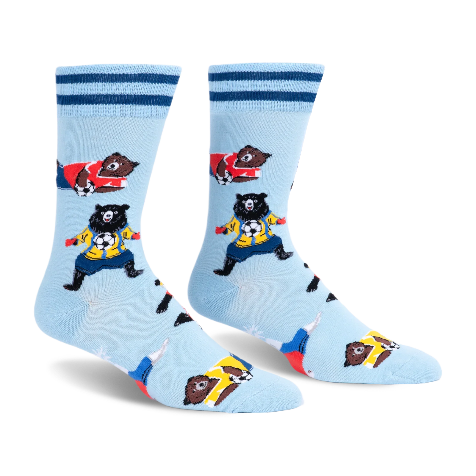 Light blue crew socks with dark blue cuff stripes featuring brown and black bears in colorful jerseys playing soccer.
