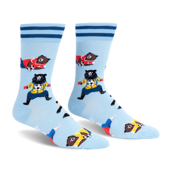 Light blue crew socks with dark blue cuff stripes featuring brown and black bears in colorful jerseys playing soccer.