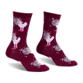 Burgundy crew socks showing a pattern of white chickens wearing pink cowboy hats and boots alongside silver disco balls.
