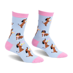 Light blue crew socks with pink accents, featuring a pattern of brown dachshunds holding martinis and wearing sunglasses.