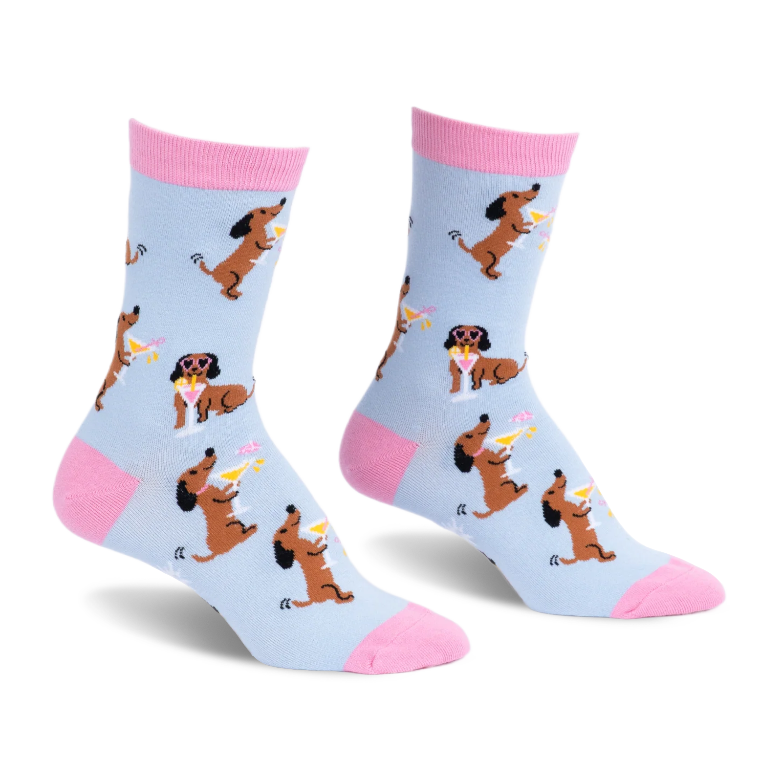 Light blue crew socks with pink accents, featuring a pattern of brown dachshunds holding martinis and wearing sunglasses.