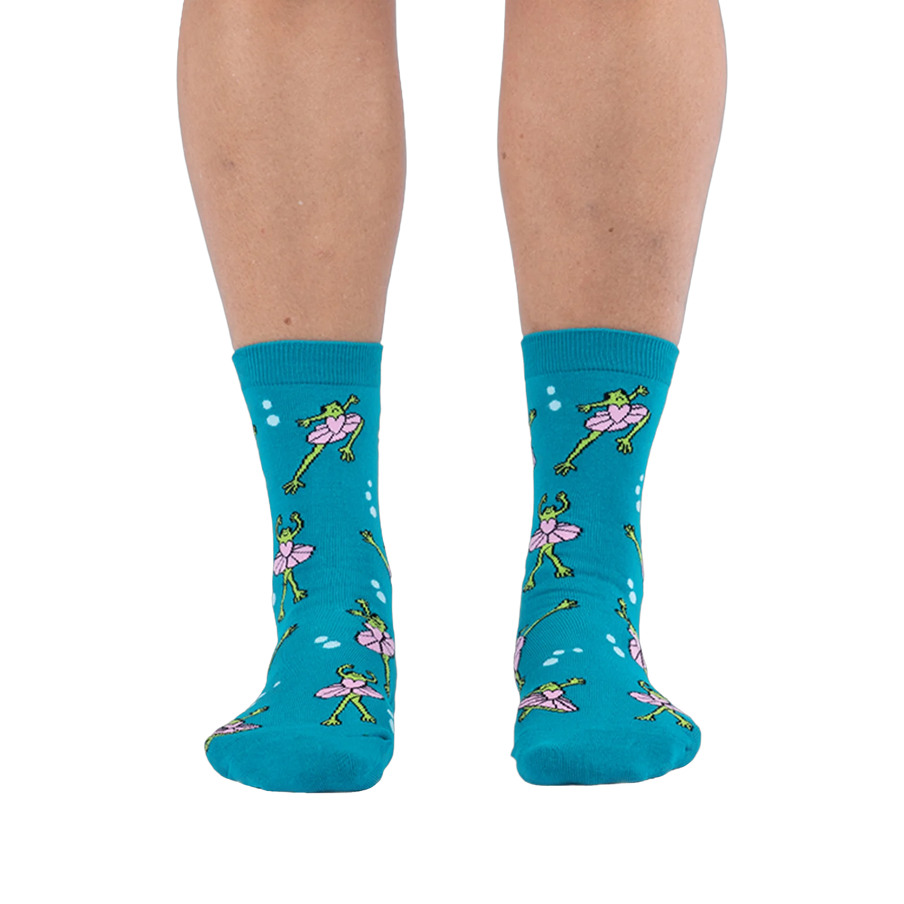 Front view of someone wearing teal crew socks featuring a pattern of green frogs in pink tutus on a black background.