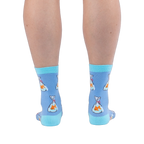 Back view of legs wearing light blue crew socks showing orange goldfish in plastic bags tied with red string and aqua heels.