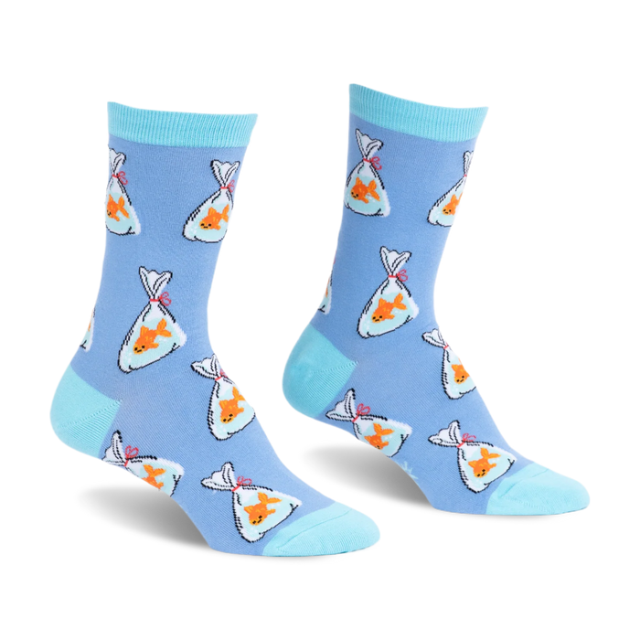 Light blue socks with a pattern of orange goldfish in plastic bags tied with red string. Bright aqua toes and cuffs.