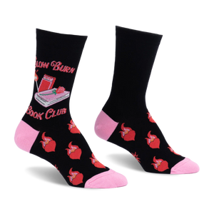 Black crew socks with pink heel and toe. Features Slow Burn Book Club text, a pink book, lit match, and flaming red hearts.