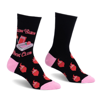 Black crew socks with pink heel and toe. Features Slow Burn Book Club text, a pink book, lit match, and flaming red hearts.