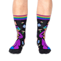Front view of someone wearing black wizard socks, showing the wizard's purple hat, staff, and striped cuffs on both legs.