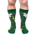 Front view of someone wearing the green socks, showing white, speckled, brown, and crested chickens with orange eggs.