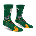 Green crew socks displaying a pattern of different chicken breeds, including speckled and crested, along with orange eggs.