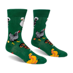 Green crew socks displaying a pattern of different chicken breeds, including speckled and crested, along with orange eggs.