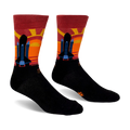 Black crew socks featuring a space shuttle silhouette against a striped maroon, red, orange, and yellow sunset background.