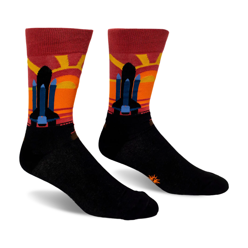 Black crew socks featuring a space shuttle silhouette against a striped maroon, red, orange, and yellow sunset background.