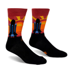 Black crew socks featuring a space shuttle silhouette against a striped maroon, red, orange, and yellow sunset background.