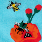 Close-up of blue knit sock fabric showing a yellow bumblebee, a green bug, red poppy petals, and two flower buds.