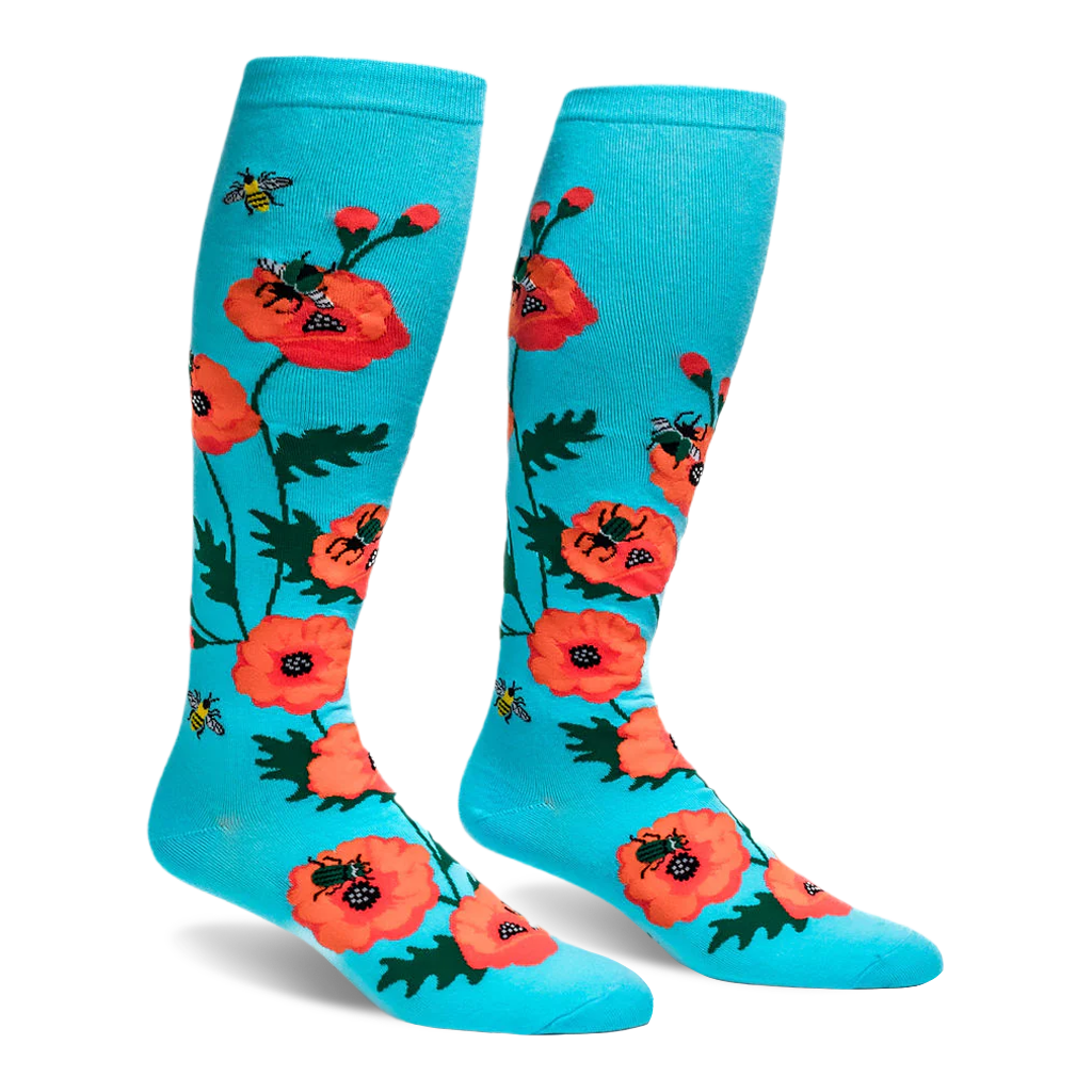 Bright turquoise knee-high socks featuring a pattern of large orange-red poppy flowers and flying yellow bumblebees.