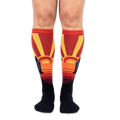 Front view of someone wearing knee-high socks, showing large yellow sunbursts and space shuttles on the outer calves.