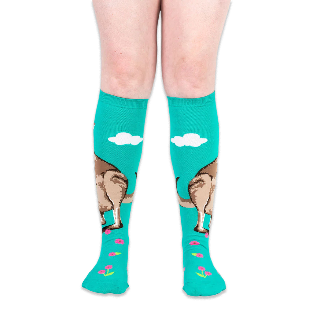 Front view of worn teal knee-high socks showing the kangaroo design wrapping around the calf and pink flowers on the feet.