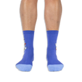 Front view of a person wearing purple crew socks with light blue toes, showing the side design wrapping around the outer edges.