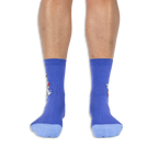 Front view of a person wearing purple crew socks with light blue toes, showing the side design wrapping around the outer edges.