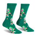 Green crew socks featuring a pattern of green frogs sitting on red and white spotted mushrooms while reading pink books.