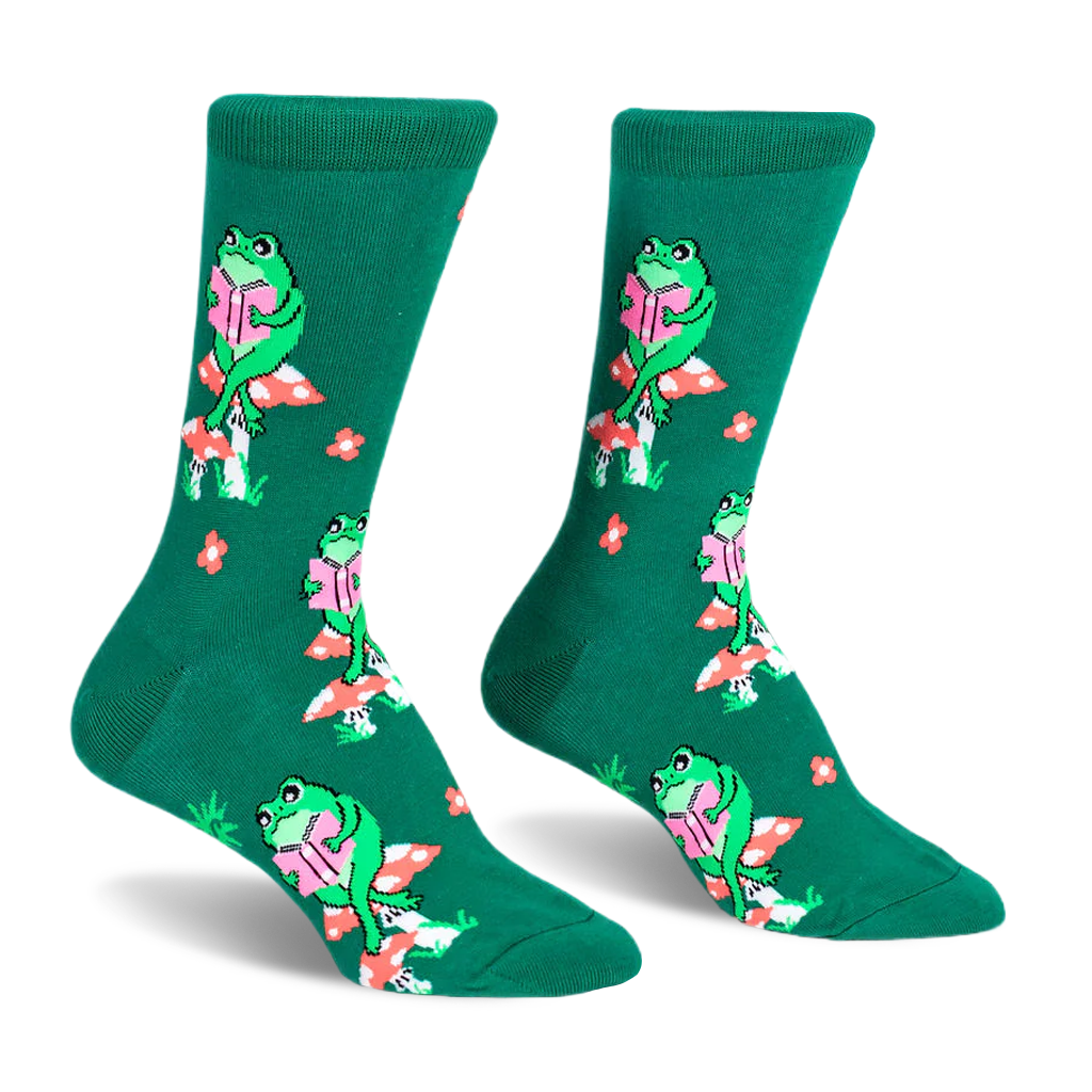 Green crew socks featuring a pattern of green frogs sitting on red and white spotted mushrooms while reading pink books.