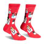 Pair of red crew socks featuring a pattern of various small dogs peeking out of white shopping bags with teal accents.