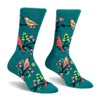 Teal crew socks featuring a pattern of red cardinals and yellow birds perched on black branches with bright pink flowers.