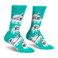 Bright teal crew socks featuring a pattern of fluffy grey and white seal pups resting on light blue and white ice floes.